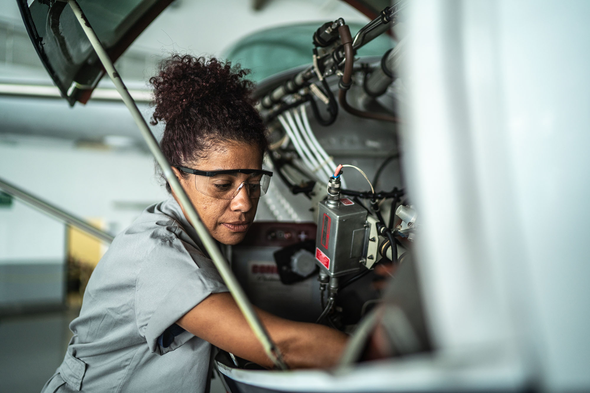 a technician working on an aircraft turbine 