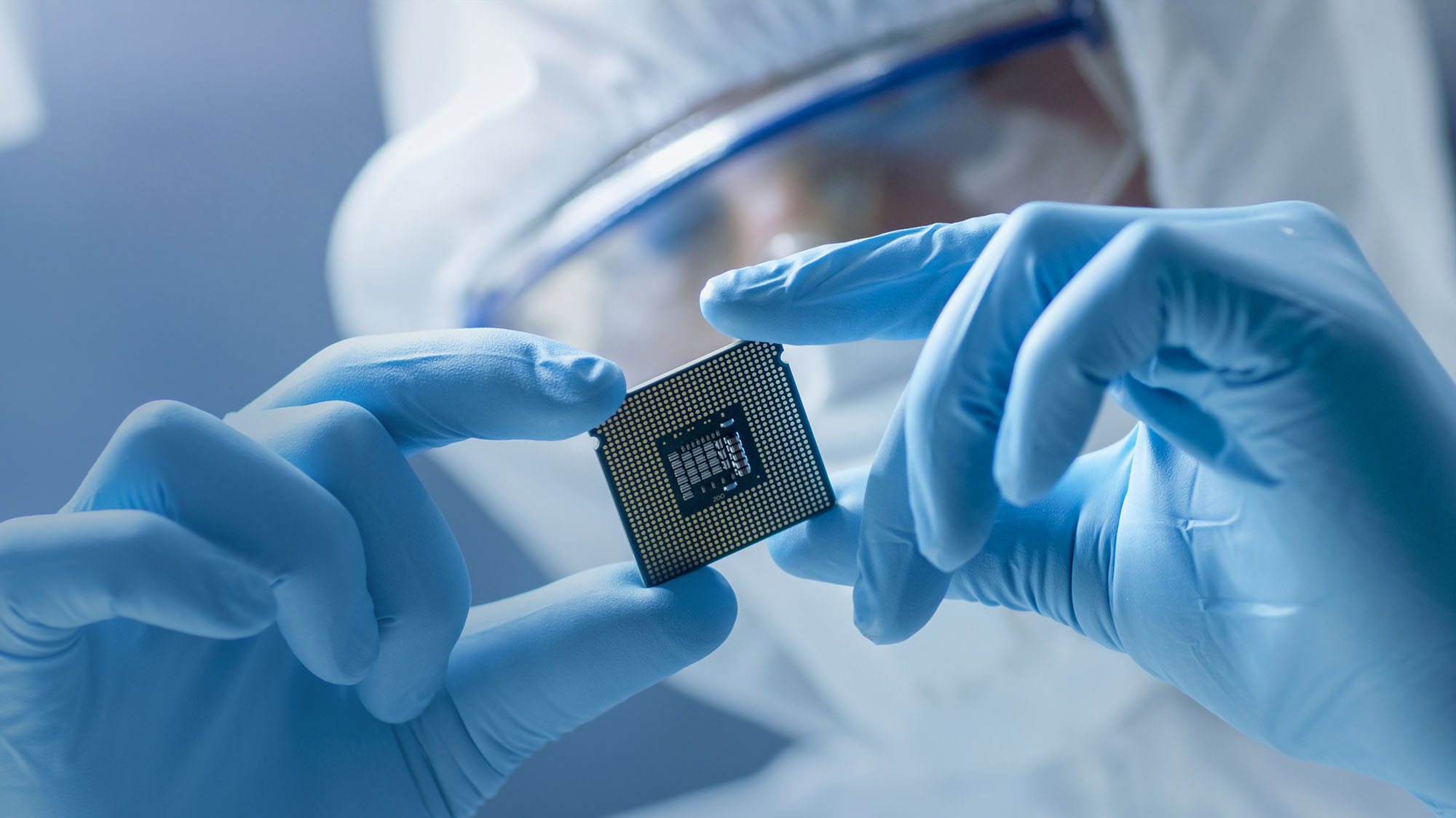 Technician holding computer chip