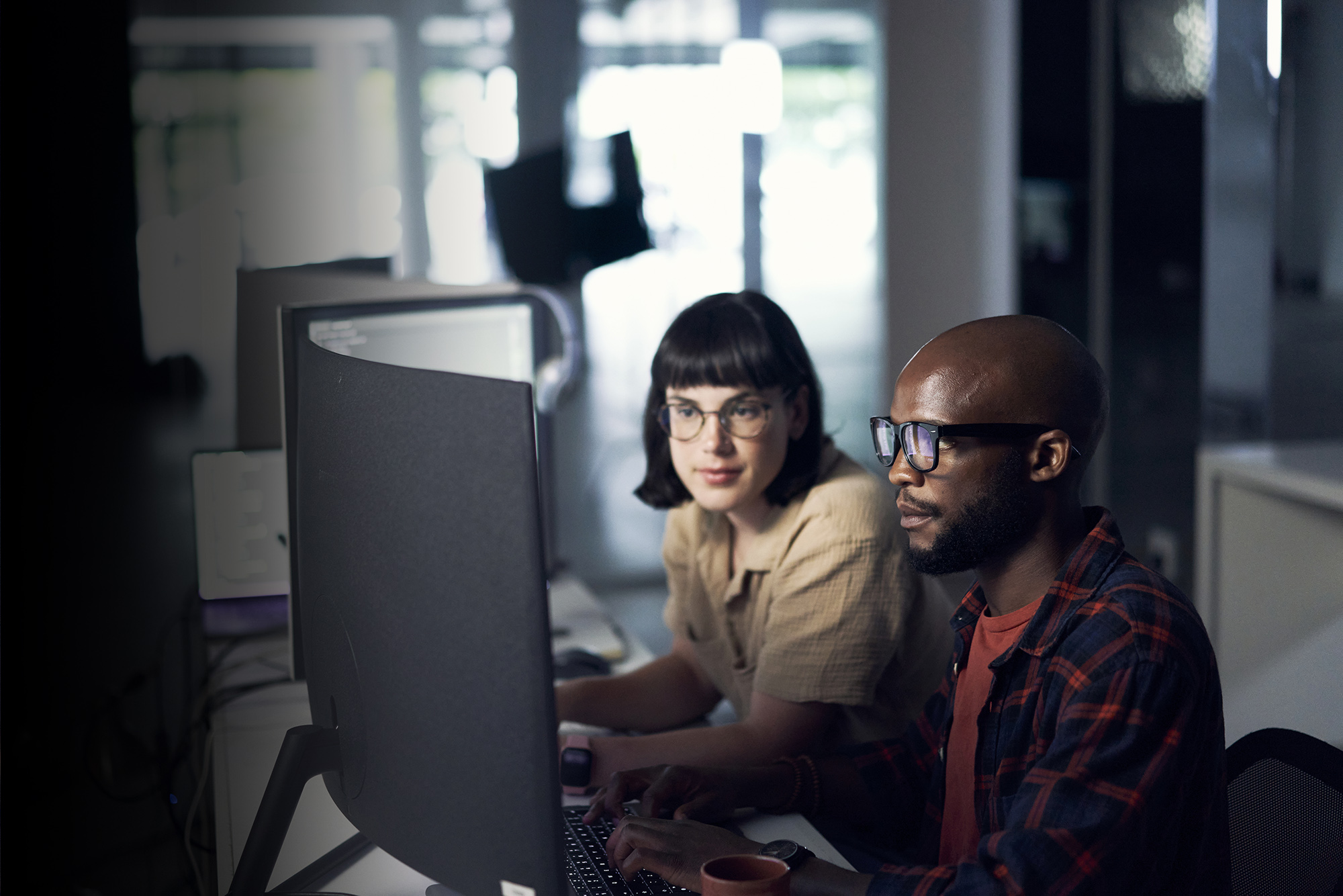 two people looking at a computer screen