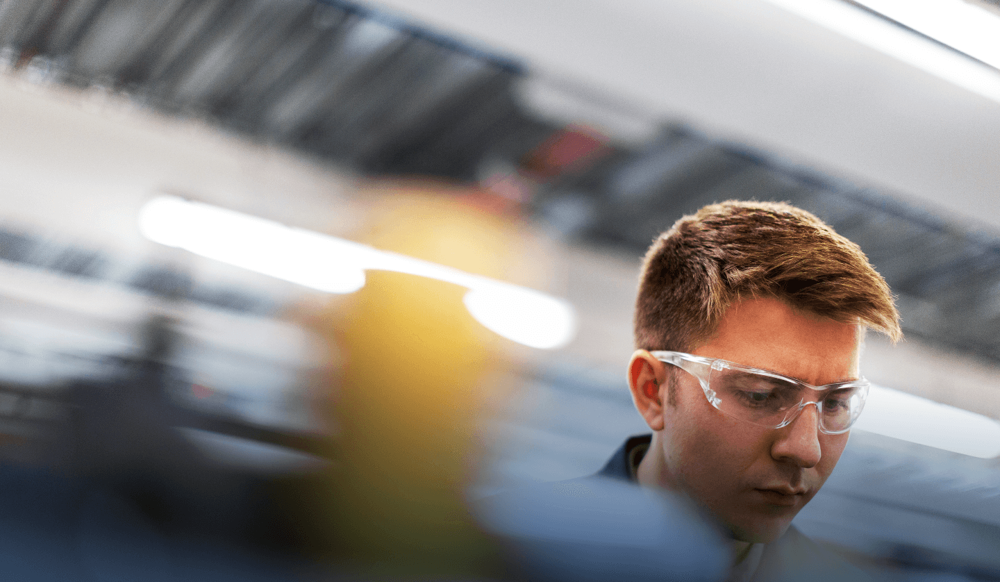 focused man in safety glasses